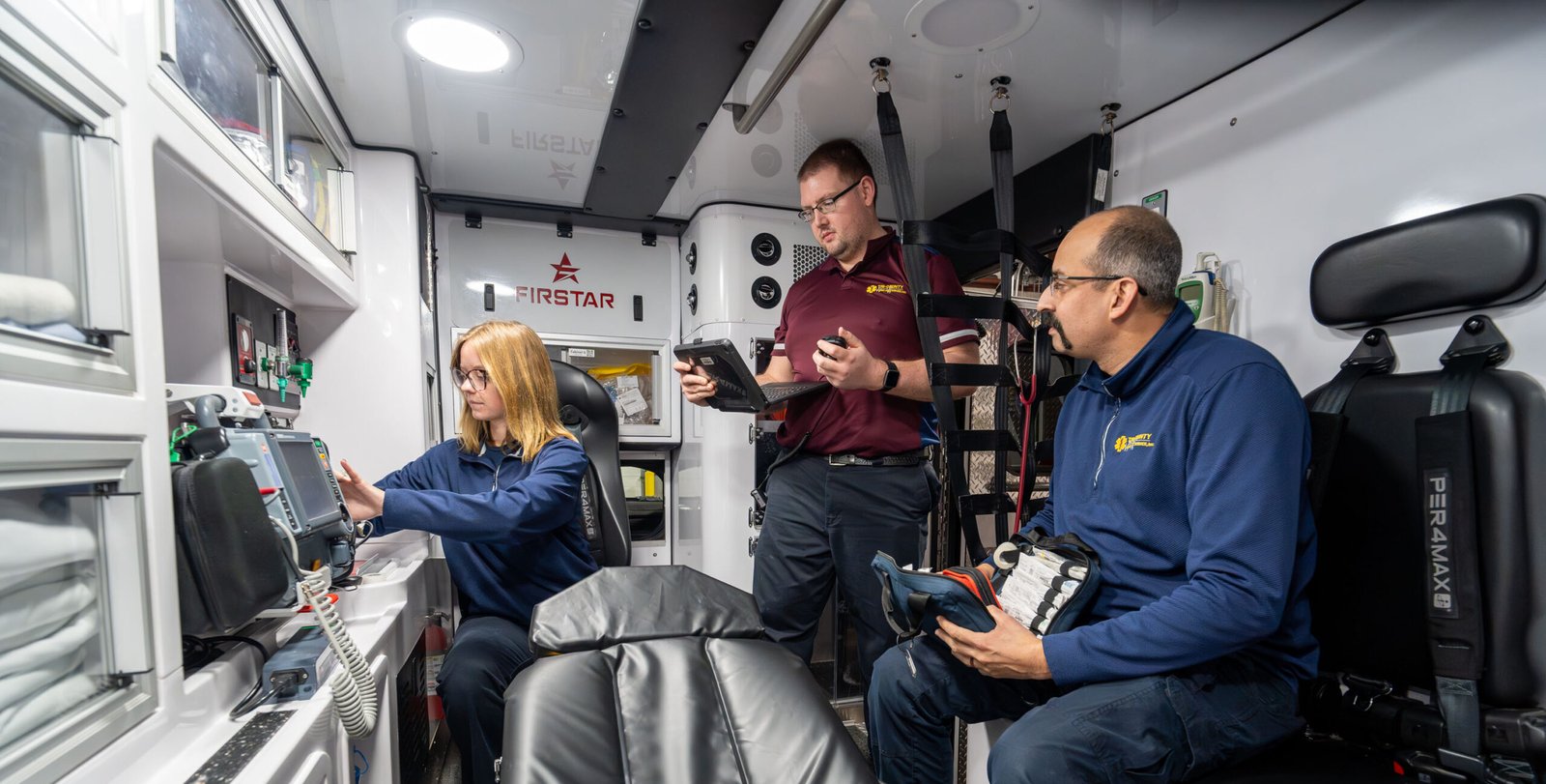 ems team inside of a ems truck providing basic life support and advanced life support